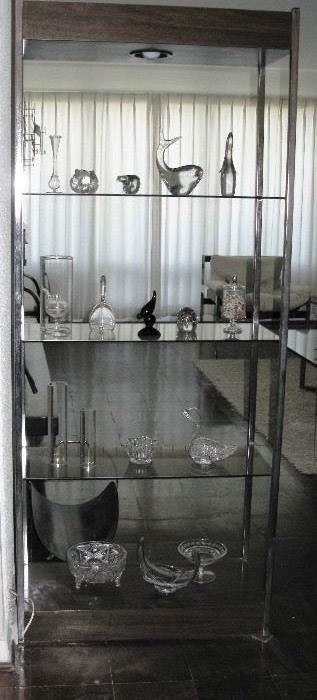beautiful glassware on glass and chrome shelf