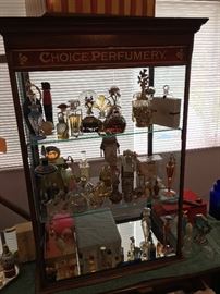 Antique Perfume display case is for sale.  Door on back of display cabinet 
