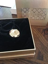 Estée Lauder limited edition 14kt gold with .25 carats diamonds.  RARE PIECE 