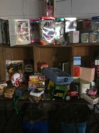 Barbies, tractors, football helments, baseball bats