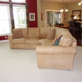 Arhaus Hadley Leather Sectional Sofa: An Arhaus Furniture Hadley Cambridge Leather Collection three piece sectional leather sofa, in camel, with right arm two seat section, left arm two seat section and center wedge pieces. This collection offers a seat depth of 21" and seat height of 20" for maximum comfort. The back cushions are attached.