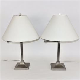 Matching Extendable Arm Lamps: A pair of silver tone extended arm table lamps featuring a square pole body with extended arm for adjusting, square base, single socket construction, and empire shape white cloth shade.