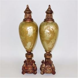 Decorative Mantel Urns: A pair of matching composition decorative mantel urns each featuring a gold over green marbled antique look with gold tone and copper top and a square base. Unmarked.