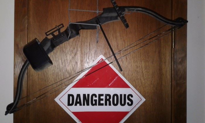 compound bow, plenty of signs, wooden and metal