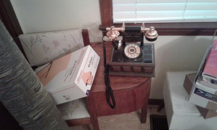 old telephone stand and nice reproduction of phone