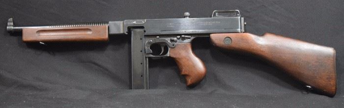 Thompson Sub machine Gun 
.45 Caliber 
Auto-Ordnance Company West Hurley.
The gun has the original gun case with 5 stick mags And cleaning rod. 
Stock, barrel, and bore are in good condition.
We think it is a 1928 A1 Made around 1979.
We have done some research the gun has most of its original parts. 
I do think some parts are USGI parts. 
Like rear sights pivot, safety and mag catch.
There was around 328 of these made.
This is Full auto.