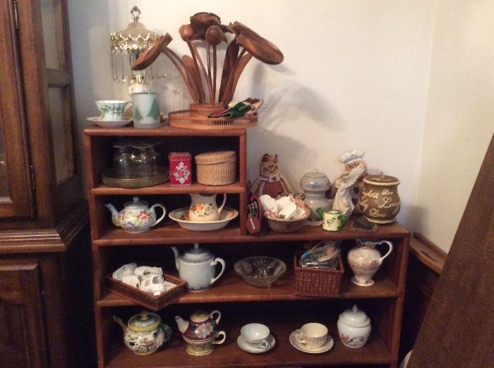 knick knack shelf or book shelf, tea cup collection and tea kettles