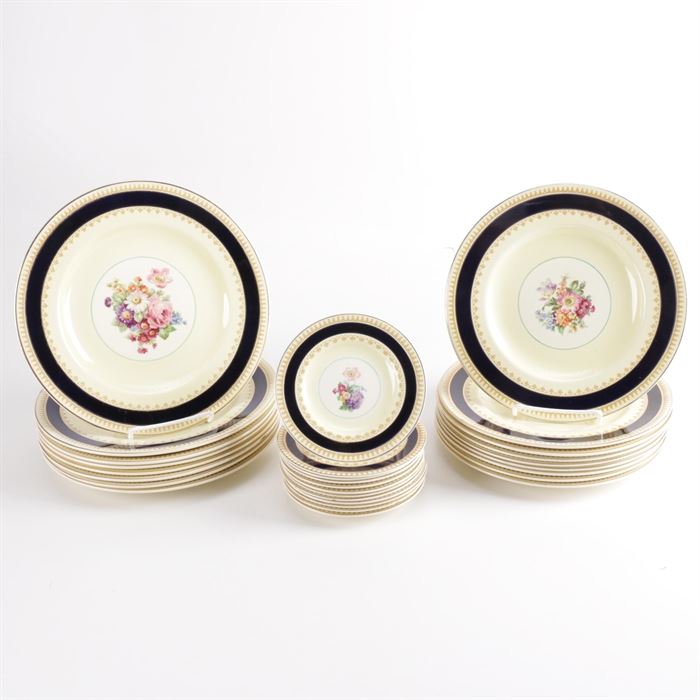 Wood & Sons "Sherborne" China Tableware: A Wood & Sons Sherborne china tableware set. This china set includes twenty-eight pieces with a gilded black border and a central floral bouquet emblem. The pieces are marked to the underside.