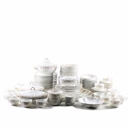 Haviland Limoges China Set: A Haviland Limoges china dinner service in a pink floral pattern. The pattern features a pink floral design with gold tone accents throughout. This set includes eleven teabag plates, one large lidded serving bowl, two large lidded casserole serving dishes, one lidded gravy boat, eleven small bowl dishes, ten bowls, set of five graduated serving platters, one medium bowl, three large serving bowls, eighteen saucers, twelve dessert plates, eleven salad plates, twelve dinner plates, eight teacups, and eight coffee cups.