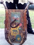 Wooden decorator piece made from mule/horse collars complete with brass end fittings.