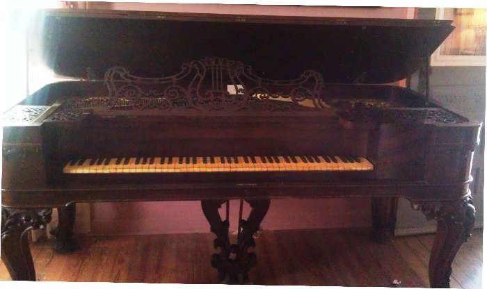 Chickering & Sons 6 foot square grand piano marked Boston. The serial number dates the piece to near 1858. Chickering is an elite piano maker, and is the name that Stienway & Stieff used for their model.