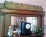 Architectural antique copper decorator piece (above mantle), Slate mantle clock, Tiffin glass tumblers, Blenko glass vase/decanter, Hessey vases.
