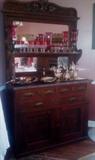 Burrell walnut buffet with marble top & mirrors. Ruby flashed glass, sterling silver & silver plate pieces.