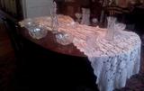 Mahogany table with 4 leaves & 6 chairs; Crocheted tablecloth, several pieces of American Brilliant (ABP) cut glass.