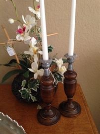 Antique wooden candlesticks; artificial orchid plant