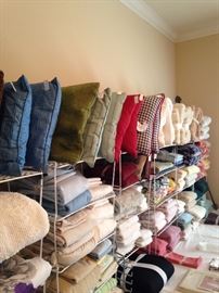 Large assortment of pillows, towels, sheets, etc.