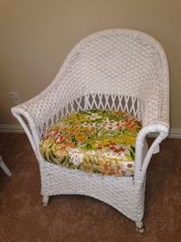 White wicker chair has matching sofa and rocker