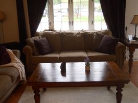 large sofa, coffee table, throw pillows, decor