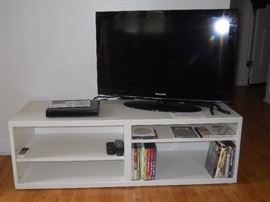 32" tv, tv stand, dvds (more not pictured). Dvd player, with remote controls.
