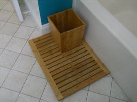 bathroom accessories. bamboo shower mat and wastebasket