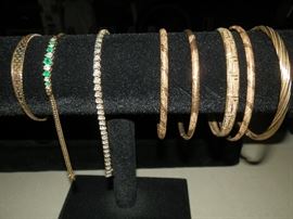 More fine jewelry...The bracelet second from left IS emeralds & diamonds...Nice!! The tennis bracelet is diamonds but as of this printing I have not ultrasonically cleaned it...diamonds are average quality or below! The price will be reflected after it's cleaned! 