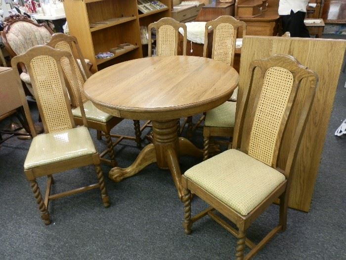 Solid oak. All chairs are excellent with 2 having small stains in the cane backs. Note the rope twist front legs! 