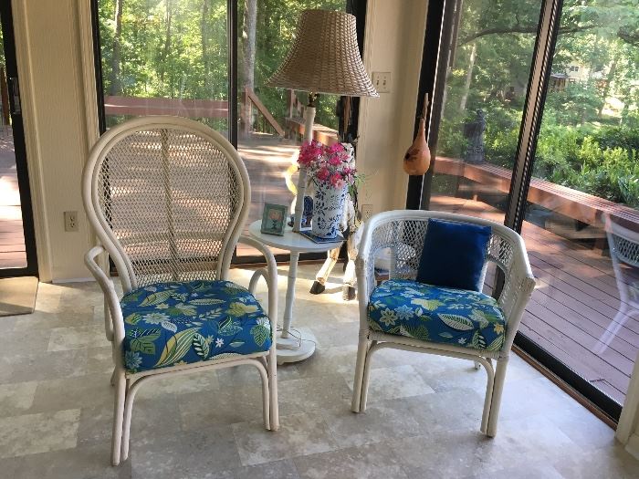 Two matching wicker chairs with cushions 