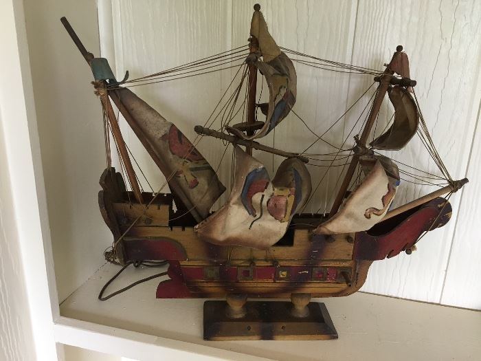 Antique, lighted wooden and canvas ship