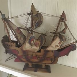 Lighted antique wood and canvas ship