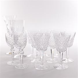 Waterford Stemware: A collection of Waterford crystal. This collection features a pair of wine goblets in the Alana pattern. Also included is eight port wine crystal glasses from Waterford in the Powerscourt pattern with cut criss-cross and arch on the bowl. And a large Waterford fluted stemware in the Lismore pattern with criss-cross and vertical cuts. And a tall champagne flute from the Millennium series with criss-cross cuts wth the Peace image to the bowl. All of the pieces are marked on the underside Waterford.