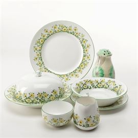 Crown Staffordshire Fine Bone China Yellow Daisy Dishware: A selection of Crown Staffordshire fine bone china yellow daisy dishware. Featuring the Crown Staffordshire pattern #13818, this assortment includes a round serving platter, a serving plate, serving bowl, covered serving dish, a creamer, and sugar bowl. This grouping also includes a white, gray, and green sugar shaker.
