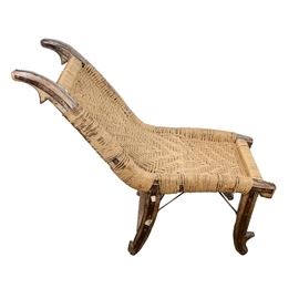 Antique Jute Chair: An antique jute chair. This chair is made out of a wood frame with a wrapped and woven jute seat. It is not marked.