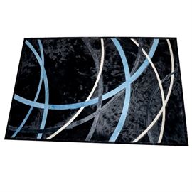 Kyle Bunting Cowhide Area Rug: A Kyle Bunting cowhide area rug. This is a contemporary cowhide rug composed of a black background with blue, gray, and cream stripes. It is marked Kyle Bunting on the back.