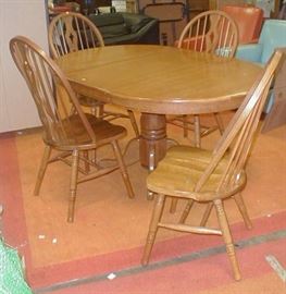 Oak Pedestal Dining Table with one leaf and four chairs.  Tuesday 1/2 off = $97.50