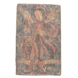 18th-19th Century Spanish Colonial Retablo of Arcángel Miguel: A late 18th to early 19th century Spanish Colonial retablo on pine depicting what appears to be the Archangel Michael. The image shows the being in a red robe with white stripes holding a sword in his left hand with his right hand holding a scale. The background is indistinct. The rustic painting is executed in black, red and yellow on a rough hewn board. 1938.0536