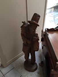 A smaller wood carving figure made in Bogota, of a man. Approx 28" tall