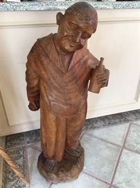 A unuasual wood carving made in Bogota Colombia of a monk and his wine bottle , approx 40" tall