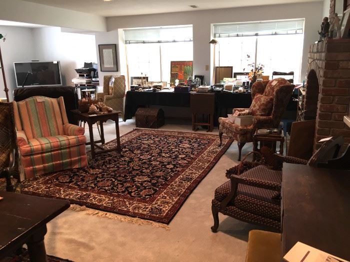 Persian rugs, wing chairs, hand-made Mexican furniture