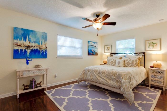 SECOND BEDROOM FEATURES GOREOUS OFF WHITE MIRRORED SIDE TABLES (2) AND MATCHING ACCENT TABLE, ARTWORK A GOGO, 8X12 GORGEOUS BLUE AREA RUG, AND SIMMONS BEAUTYREST QUEEN BED SET.