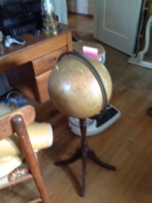 Globe on stand, old bathroom scale, desk
