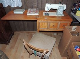 vintage Sears Kenmore sewing machine in table with chair. Works!