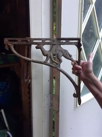 Pair of "hard to find" cast iron camel shelf brackets