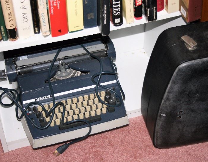 Electric typewriter with carrying case.