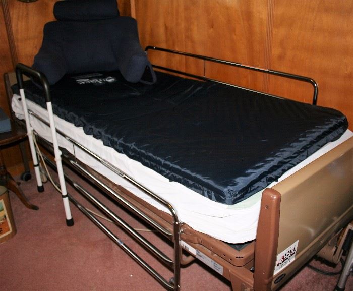 Electric hospital bed with gel topper.