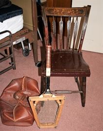 Antique chair, vintage leather bag and vintage tennis racquet. 