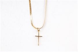14K Gold Cross Pendant and Necklace: A 14K cross pendant and necklace set. It features a basic cross pendant and a herringbone chain necklace.