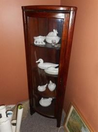 corner cabinet , milk glass figural covered containers