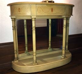 one of a pair of mirrored back demi-lune consoles