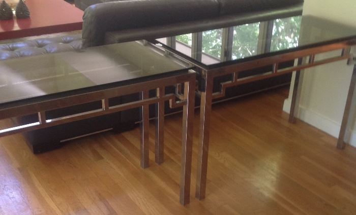 Pair of Chinese inspired chrome base smoked glass top console tables