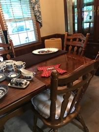 Immaculate dining room table that could seat up to 12 with the two boards. Includes table pads and four chairs.